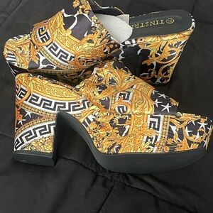 Bold Black and Gold Platform Booties with Geometric Design